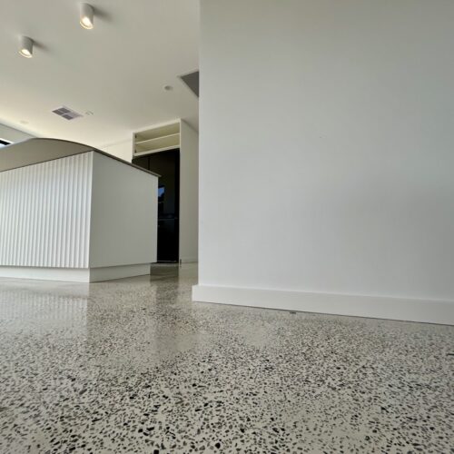 An image of a kitchen with a white floor.