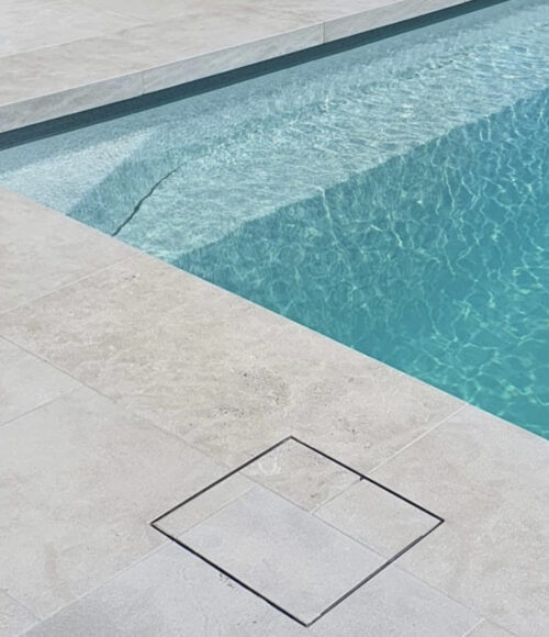 A swimming pool with a tiled floor.