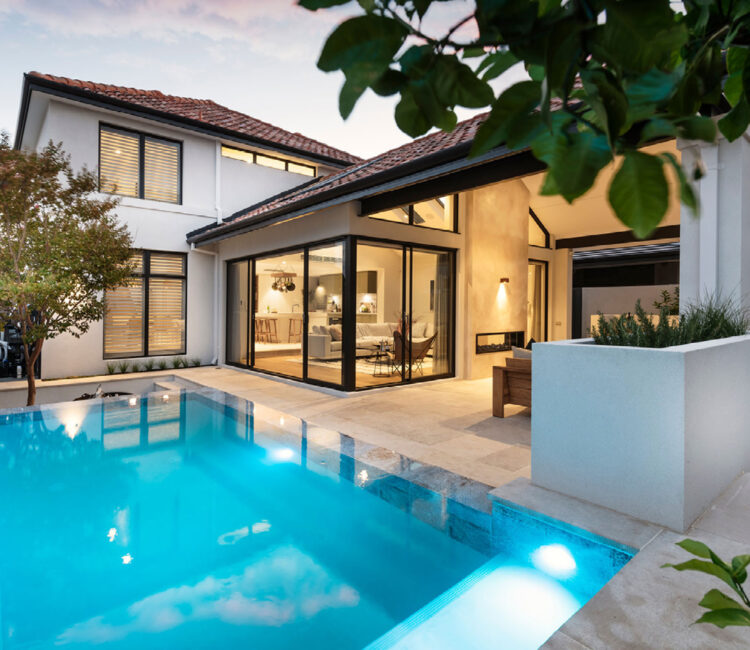 A modern home with a swimming pool and patio.