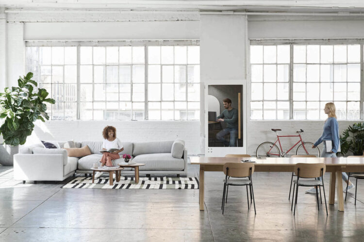 A living room with a couch, chairs and a table.